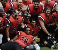  ?? PHOTO BY JOE BOYLE ?? RPI celebratin­g with the Transit Trophy at the RPI East Campus Stadium on Saturday, September 9, 2018.