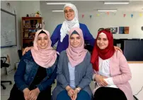  ?? AFP ?? Tamara Awaysa, Wassan Al Sayyed, and Massa Halawa with their mentor Yamama Shakaa in the West Bank city of Nablus. —