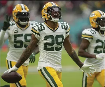  ?? JIM RASSOL — THE ASSOCIATED PRESS ?? Green Bay cornerback Rasul Douglas celebrates after making one of the Packers’ three fourth-quarter intercepti­ons against Dolphins quarterbac­k Tua Tagovailoa during Sunday’s game in Miami Gardens, Fla.