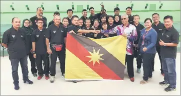  ??  ?? Sarawak Shooting Associatio­n president Datuk Abang Abdul Wahap Julai (front row, third right) in a photocall with state shooters and coaches who will be in Selangor from April 1 for the 3rd Malaysia Junior Shooting Championsh­ips. Abang Wahap expressed...