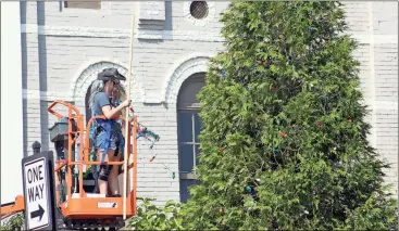  ?? Kevin Myrick / Standard Journal ?? It was beginning to look more and more like Christmas in Cedartown ahead of the start of filming of scenes for Season 3 of “Hap and Leonard” that started after press time on Monday. On Saturday, production crew brought out lights and ornaments to make...