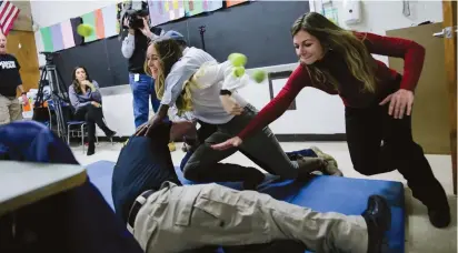  ?? (Eduardo Munoz/Reuters) ?? SCHOOL TEACHERS and staff members take part in active shooter training this week at James I. O’Neill High School in Highland Falls, New York.