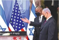  ?? (Menahem Kahana/Pool via Reuters) ?? US DEFENSE SECRETARY Lloyd Austin and Prime Minister Benjamin Netanyahu arrive to give a statement after their meeting yesterday.