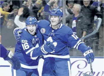  ?? THE CANADIAN PRESS FILES ?? Toronto’s Patrick Marleau, right, celebrates his game-winning goal against the Boston Bruins with Mitch Marner earlier this month in Toronto.