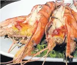  ??  ?? Grilled giant river prawns.