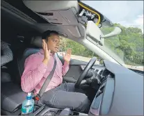  ?? AP PHOTO ?? Kaushik Raghu, Senior Staff Engineer at Audi, takes his hands off the steering wheel while demonstrat­ing an Audi self driving vehicle on I-395 expressway in Arlington, Va., July 15.