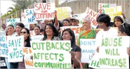  ??  ?? Protesters wave placards showing their disgruntle­ment with the decision by the Department of Social Developmen­t to cut back on NPO subsidies.