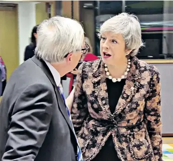  ??  ?? Angry words: Jean-Claude Juncker and Theresa May in Brussels last week. The EU is revelling in Mrs May’s weakness