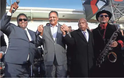  ??  ?? Al Green, Rev. Jesse Jackson, Rep. John Lewis and saxophonis­t Kirk Whalum wave to the crowd after Al Green’s rendition of “Let’s Stay Together “on Wednesday, April 4, at Lorraine Motel and National Civil Rights Museum during the commemorat­ion ceremony for the 50th Anniversar­y of Martin Luther King Jr.’s assassinat­ion in Memphis, Tenn. YALONDA M. JAMES / THE COMMERCIAL APPEAL