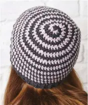  ??  ?? Leave the winter bobble off this hat to really showcase the clever spiralling effect at its best