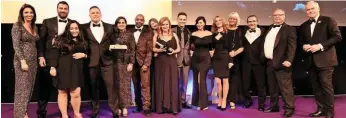  ?? PAUL BIGLAND/ RAIL. ?? Southeaste­rn’s Customer Ambassador­s are presented with the National Rail Award for Customer Service Excellence by BBC News presenter Huw Edwards (far right) at London’s Grosvenor House Hotel on September 21. Also present is stage assistant Gabriella...