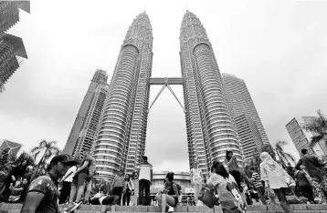  ??  ?? Malaysia’s GDP is expected to moderate to 5.3 per cent this year from six per cent in 2017 supported by strong private consumptio­n, says Standard Chartered Bank’s analysts. — Reuters photo