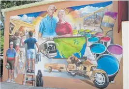  ??  ?? This mural depicts Bob and Harriet Porter, the founders of the Lake Placid Mural Society.