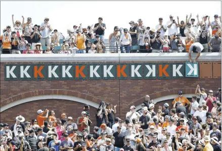  ?? JOSIE LEPE/STAFF ?? The crowd cheers as strikeout marker No. 14 for Madison Bumgarner goes up on the wall in right field on Sunday at AT&T Park.