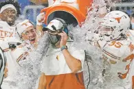  ?? ERIC GAY/ASSOCIATED PRESS FILE PHOTO ?? Texas coach Tom Herman is doused by players for winning the Alamo Bowl over Colorado on Tuesday in San Antonio, Texas. Herman was fired Saturday and quickly replaced.