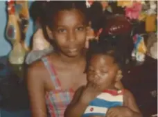  ??  ?? Melonie Biddersing­h, seen holding a baby. Her body was discovered in 1994 but not identified until 2012. Her father and stepmother are on trial.