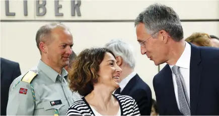  ?? (Francois Lenoir/Reuters) ?? NATO SECRETARY-GENERAL Jens Stoltenber­g (right) meets Gulin Dinc, Turkey’s deputy permanent representa­tive to NATO, at the start of the North Atlantic Council at the alliance headquarte­rs in Brussels yesterday.