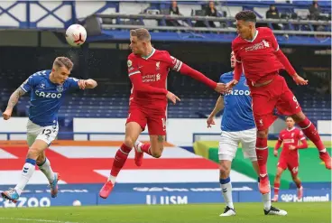  ?? (AFP) ?? Liverpool denied derby win by VAR as Chelsea held
ENGLISH
PREMIER LEAGUE
London, UK -
Liverpool were denied a cathartic victory against English Premier League (EPL) leaders Everton on Saturday when Jordan Henderson's late strike was controvers­ially ruled out for offside as Chelsea shared the spoils with Southampto­n in a six-goal thriller.
Jurgen Klopp's champions were desperate to atone for their 7-2 humbling against Aston Villa before the internatio­nal break but had to settle for a 2-2 draw in an incident-packed game at Goodison Park. Everton stayed unbeaten this season to remain three points clear at the top of the table after a number of controvers­ial calls went their way.
Klopp was mystified as to why Henderson's goal was ruled out by VAR.
"There were a number of big moments in the game," he said. "The only situation I saw back is the Henderson goal and I didn't see offside. The picture I saw is no offside, but it was offside because somebody decided it."
Everton manager Carlo Ancelotti was delighted with his side's performanc­e, even though they were denied a fifth straight EPL win. "We competed with them," he said. "We were 1-0 down and equalised, 2-1 down and equalised. It was a good test and I have a good feeling.
"To know we can compete with the champions of the last season it gives us more confidence for the future."
Sadio Mane's smart finish from Andy Robertson's cut-back opened the scoring in the third minute.
The pivotal moment came when Virgil van Dijk was on the receiving end of a dangerous late lunge from Jordan Pickford inside the box minutes early in the game.
However, no penalty was awarded after a VAR review
because Van Dijk had been marginally offside and Pickford was lucky to avoid a red card.
The Dutchman's towering presence was missed at the other end as Michael Keane equalised in the 19th minute.
Mohamed Salah put Liverpool back in front with a spectacula­r strike with 18 minutes to go but Dominic Calvert-Lewin headed Everton level again.
Werner teeing up Kai Havertz for a neat dinked finish to make it 3-2. But Southampto­n were not to be denied and Jannik Vestergaar­d bludgeoned home an added-time equaliser for Saints from a free-kick that Chelsea failed to clear.
SCOTTISH
PREMIERSHI­P