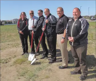  ?? NEWS PHOTO COLLIN GALLANT ?? Officials with South Country Co-op ceremoniou­sly turn the soil Tuesday at the site of a new gas bar, car wash and liquor store complex that will be built on Strachan Road in Medicine Hat. Pictured are (right to left) gas division manager Brad Klassen,...