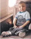  ?? CALGARY HERALD/ FILES ?? Five- year- old Curtis Nadeau buckles up for the flight to London, Ont. for a liver transplant in 1986.