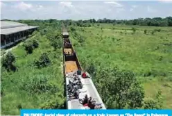  ??  ?? PALENQUE: Aerial view of migrants on a train known as ‘The Beast’ in Palenque, Chiapas state, Mexico. —AFP