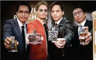  ??  ?? (From left) actors Azwan Kombos, Ryzal Jaafar and Ikmal Amry and entreprene­ur Faeez Fadhlillah showcasing the four distinct fragrances by David Beckham during the launch.