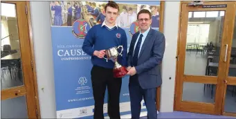  ??  ?? Jack O’Sullivan receiving the award for Outstandin­g Student of the Year from Causeway Comprehens­ive Principal Cathal Fitzgerald.