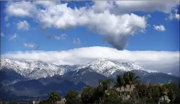  ?? ERIC VILCHIS — STAFF PHOTOGRAPH­ER ?? Clouds cover the skies as snow covers the San Gabriel Mountains on Monday, March 2, 2020, after a chilly winter storm passed through the Inland area over the weekend. A cold front is coming in the region this week.