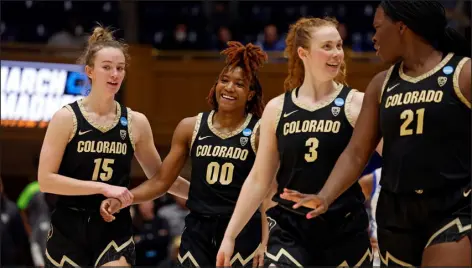  ?? KARL B. DEBLAKER — THE ASSOCIATED PRESS ?? From left, Colorado’s Kindyll Wetta, Jaylyn Sherrod, Frida Formann and Aaronette Vonleh celebrate during overtime of Monday night’s second-round NCAA Tournament game.