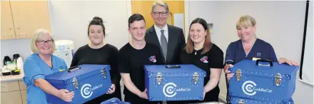  ??  ?? Generous gesture Michael and Jillian have already raised £9,000 to buy Cuddle Cots, which they presented to midwives Moira Malcolmson, Leanne Fletcher and Jacqueline Crawford and consultant Jim Robins at Paisley Maternity earlier this year