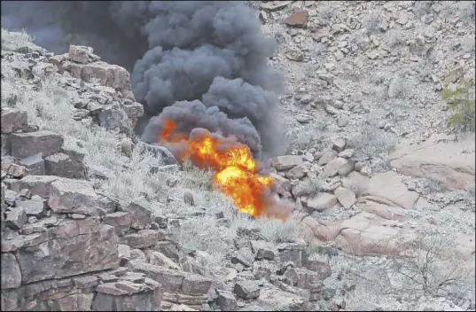  ?? Teddy Fujimoto ?? The scene of the helicopter crash near Quartermas­ter Canyon in Arizona on Feb. 10, 2018, that left five people dead.