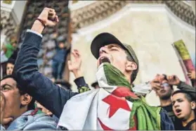  ??  ?? Continenta­l drift: Algerians (above) demonstrat­e against Abdelaziz Bouteflika’s bid for a presidenti­al fifth term. People hold Chinese and Djiboutian flags (left) at the launch of a contructio­n project backed by China. Kenya’s floricultu­re industry (below left) employs about 100 000 people. The civil war in Libya (below) continues.