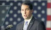  ?? Mic Smith Associated Press ?? WISCONSIN GOV. Scott Walker, left, railed against the handling of the Benghazi attack, while Sen. Marco Rubio of Florida rebuked China’s leaders. Both trail Donald Trump in polls in South Carolina and elsewhere.