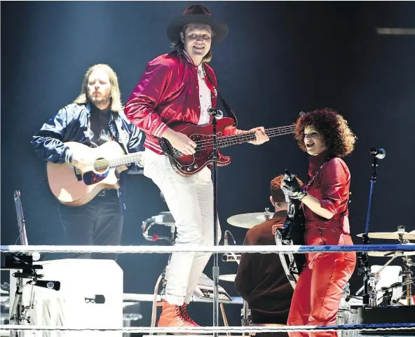  ?? — INVISION/AP FILES ?? Tim Kingsbury, left, Win Butler and Regine Chassagne of Arcade Fire will perform at the 2018 Juno Awards broadcast on Sunday, March 25 at Rogers Arena. Burnaby crooner Michael Buble has signed on to host the broadcast.