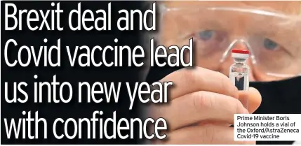  ??  ?? Prime Minister Boris Johnson holds a vial of the Oxford/AstraZenec­a Covid-19 vaccine