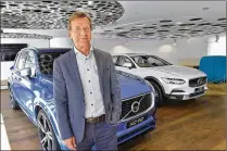  ?? JONAS ERKSTRÖMER / TT / VIA ASSOCIATED PRESS ?? Hakan Samuelsson, CEO of Volvo Cars, stands in the company’s showroom Wednesday in Stockholm, Sweden. The carmaker will stop building gasoline-only vehicles in 2019, citing customer demand for all-electric propulsion.