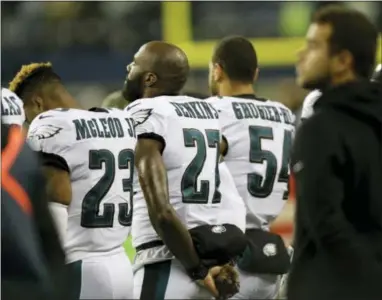  ?? JOHN FROSCHAUER — THE ASSOCIATED PRESS ?? The Eagles’ Rodney McLeod, left, stands next to Malcolm Jenkins, center, and Kamu Grugier-Hill during the singing of the national anthem last Sunday in Seattle.