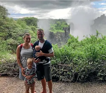  ??  ?? Narelle, 32, Will, 33, Henson, with their son Kepler, 4, and daughter Elodie, 5 months, worried about the impact of Covid-19 on their town.