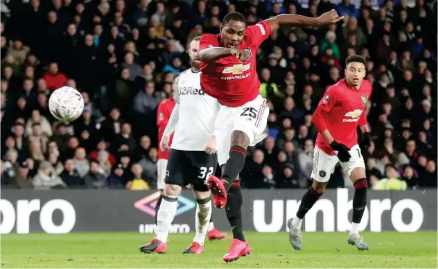  ?? Reuters ?? ↑ Manchester United’s Odion Ighalo scores against Derby during their FA Cup fifth round match on Thuradsy.