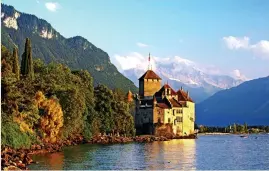  ??  ?? Glowing: Chateau de Chillion on lake Geneva, near Montreux