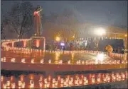  ?? AFP ?? Residents light candles to commemorat­e the victims of the 1932-33 Holodomor, Ukrainian for ‘death by starvation’, in Lviv amid the Russian invasion of Ukraine, on Saturday.