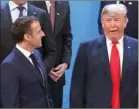  ?? The Associated Press ?? French President Emmanuel Macron and President Donald Trump gather for the group photo of G20 Leaders in Buenos Aires, Friday.