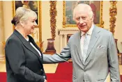  ?? ?? The King greets Dame Martina Milburn, a trustee of the Windsor Leadership Trust
