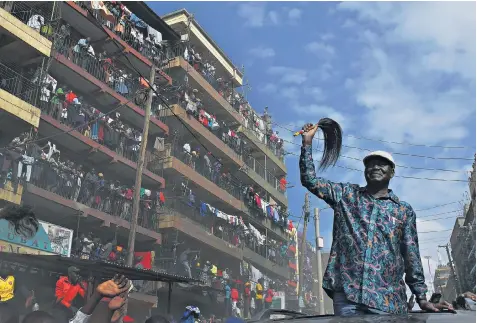  ??  ?? Kenya’s defeated opposition leader Raila Odinga arrives in the Mathare district of Nairobi yesterday. He urged his supporters to strike after an election he claims was stolen