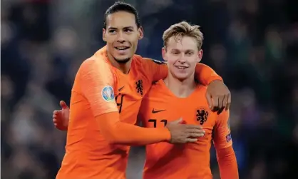  ??  ?? Virgil van Dijk celebrates with Frenkie de Jong after the Netherland­s sealed Euro 2020 qualificat­ion against Northern Ireland. Photograph: Soccrates Images/Getty Images