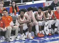  ?? AP PHOTO/SUSAN WALSH ?? Clemson players sit on the bench near the end of the second half of the Atlantic Coast Conference NCAA college basketball tournament after their lost to Boston College, on March 13 in Washington.