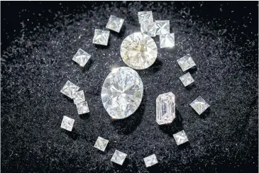  ?? PHOTOS BY REUTERS ?? Various Aether diamonds made from captured CO2 are pictured at the RFG Manufactur­ing Riviera jewellery design facility in Manhattan.