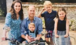  ??  ?? Smiles better: The Cambridges’ official Christmas card photograph