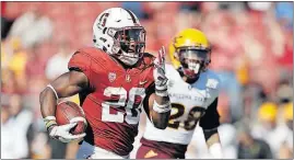  ?? JOSE SANCHEZ/THE ASSOCIATED PRESS] [MARCIO ?? Stanford running back Bryce Love used his breakaway speed to set an NCAA record with 12 touchdown of 50 yards or more this season.