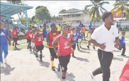  ?? ?? Mills jogging with players from the GFF academies